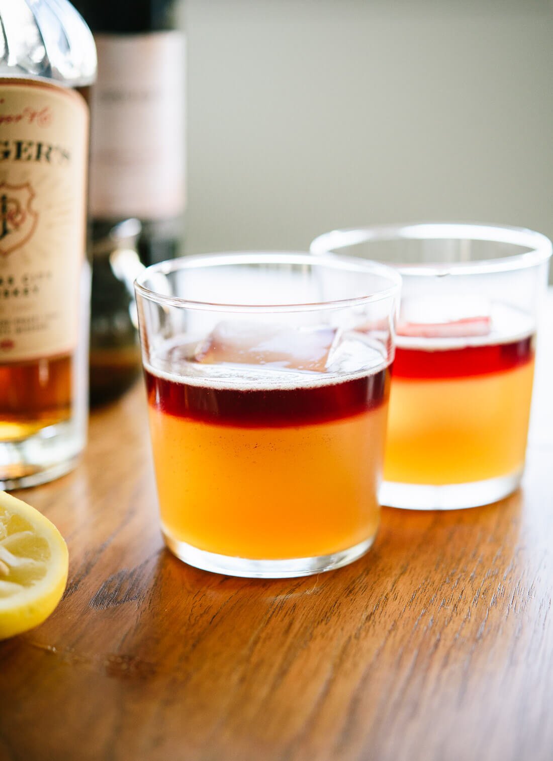 Make your own naturally sweetened New York sour cocktails at home! They're essentially whiskey sours, with a red wine float on top. Beautiful and delicious! cookieandkate.com