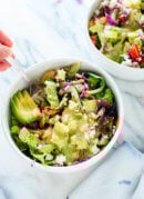 This delicious Mexican green salad with jalapeño-cilantro dressing is super fresh and mega nutritious! Vegetarian (easily vegan) and gluten free. cookieandkate.com