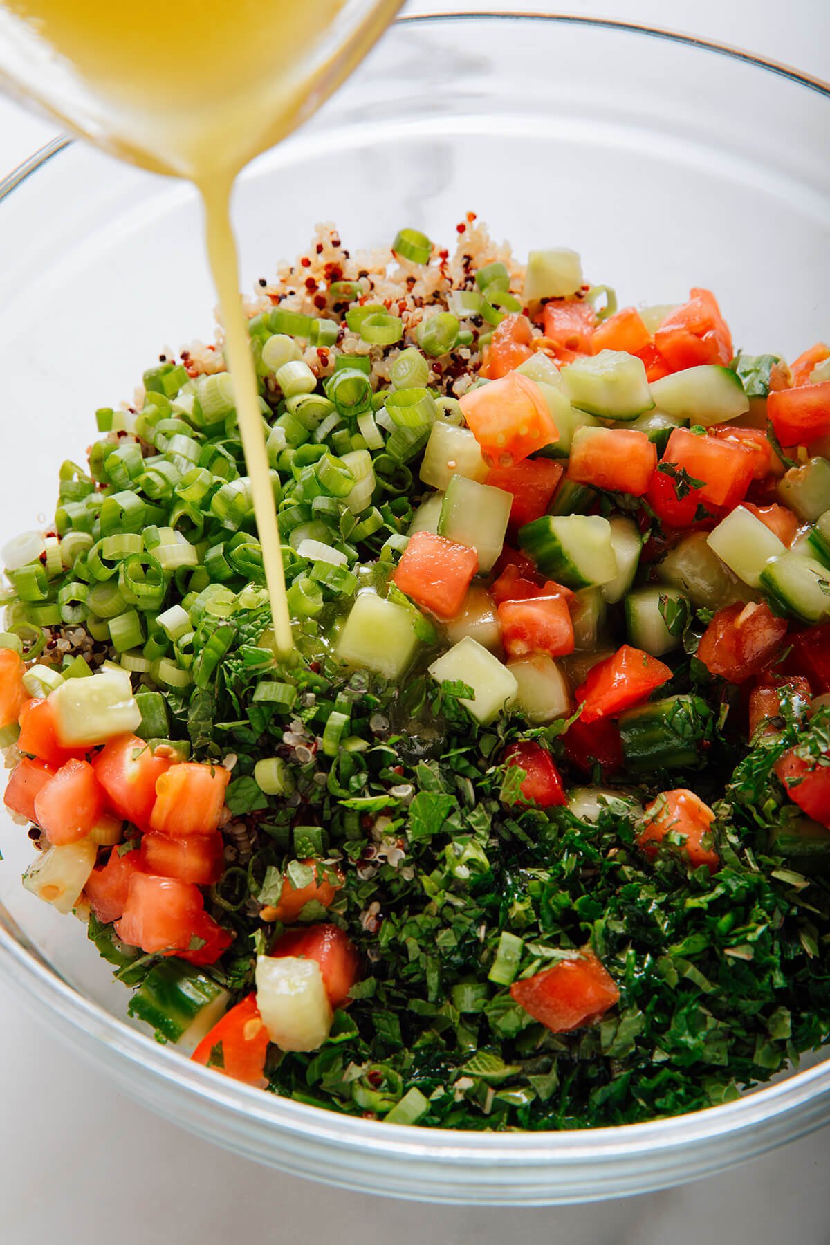 pouring lemon dressing