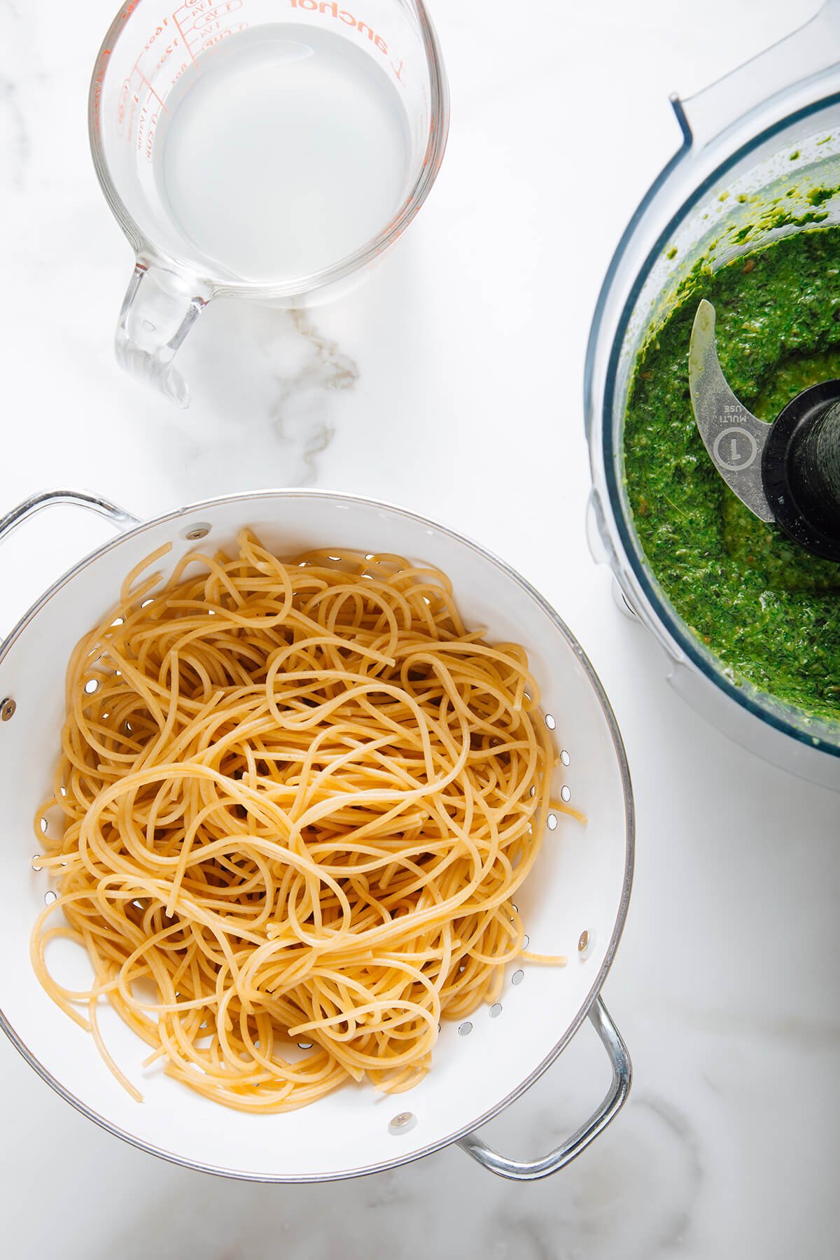 cooked spaghetti and pesto