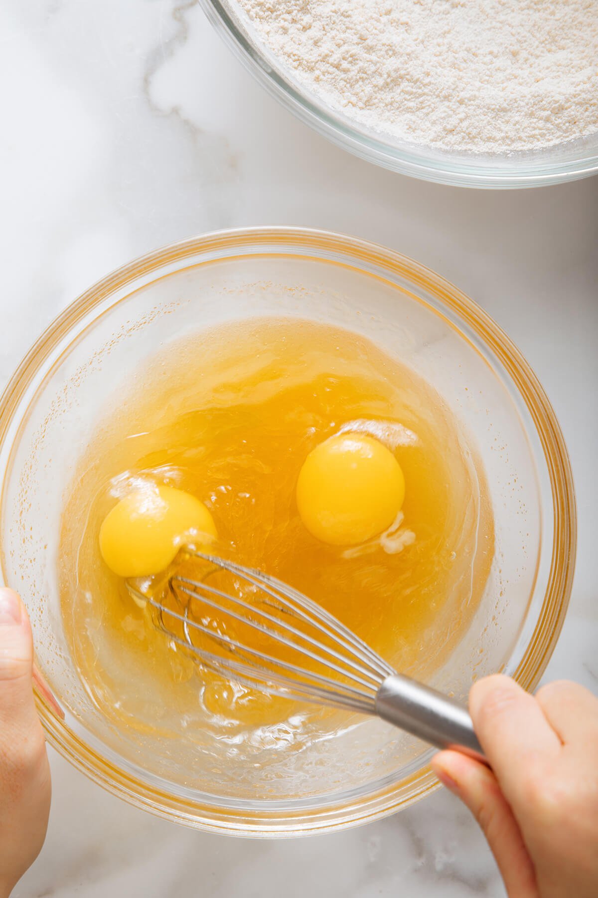 whisking eggs and oil